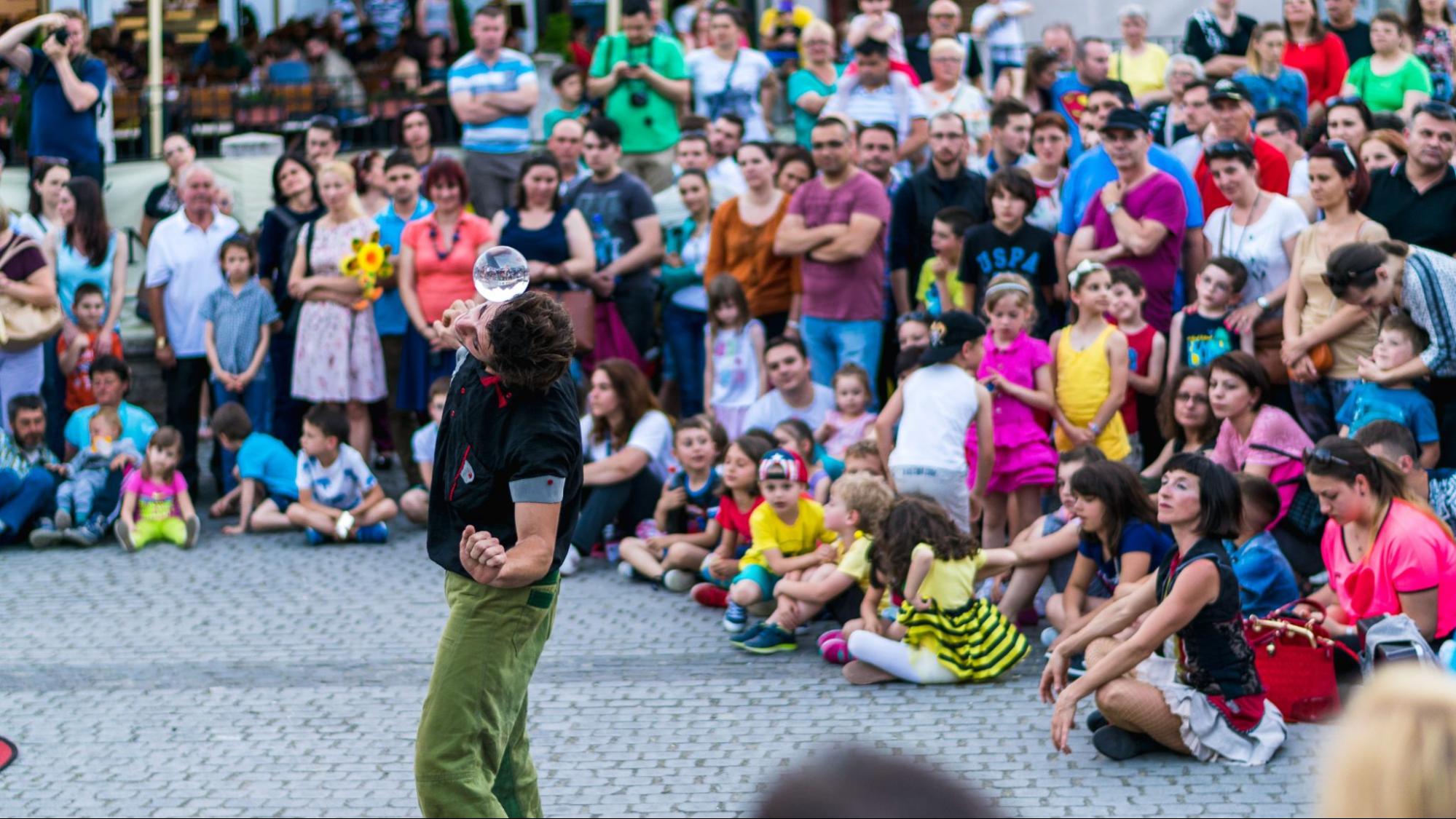 A member of Kinemtatos, Manoamano Circo, Argentina performing a trick in the Little Square during Sibiu International Theatre Festival, Sibiu, Romania
