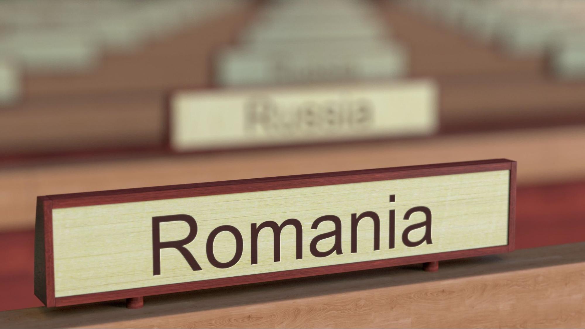 Romania name sign among different countries plaques at international organization